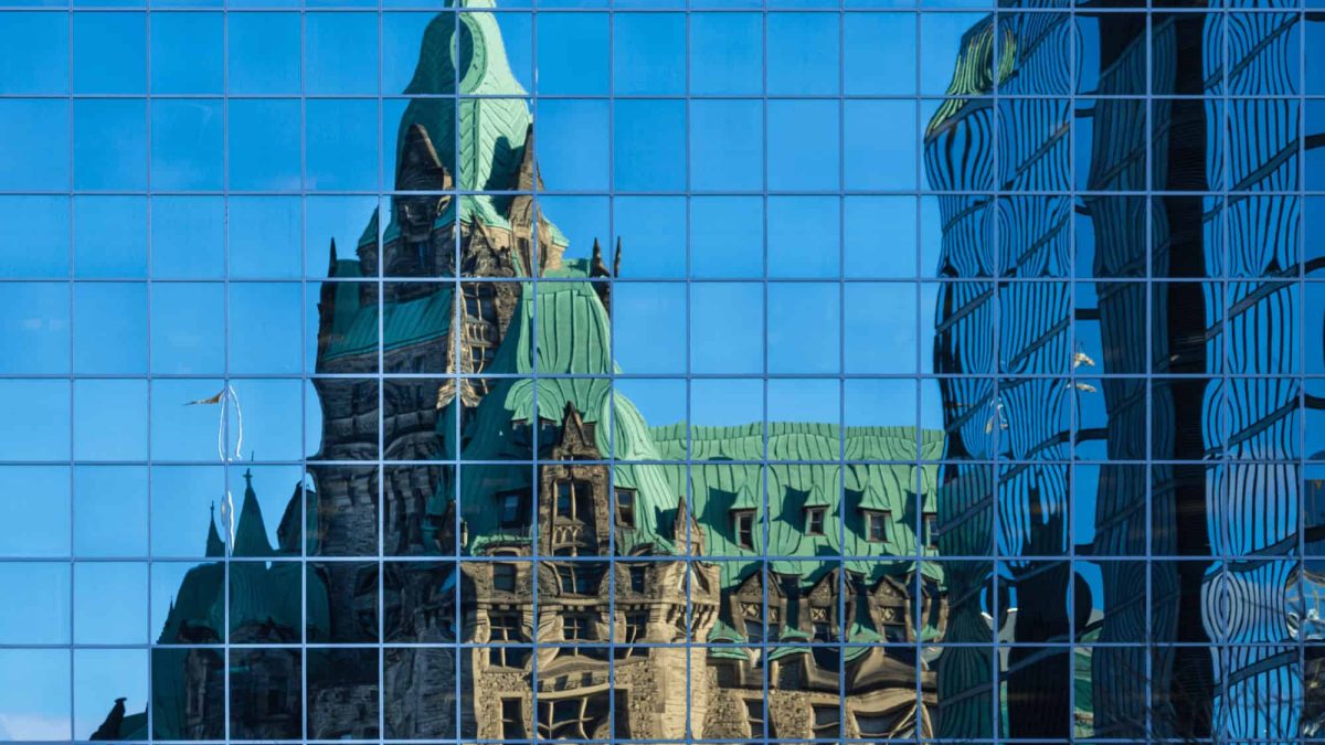 Parliament reflected on a glass building
