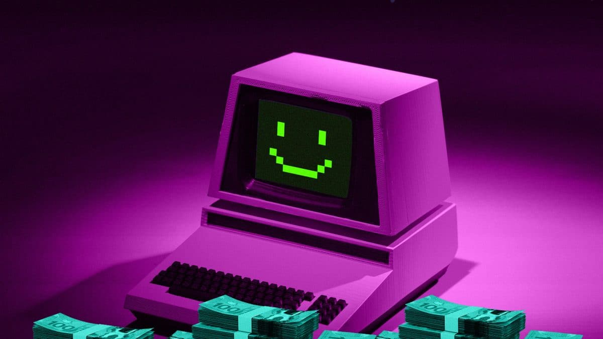 Piles of cash surround a computer with a smile on its screen.