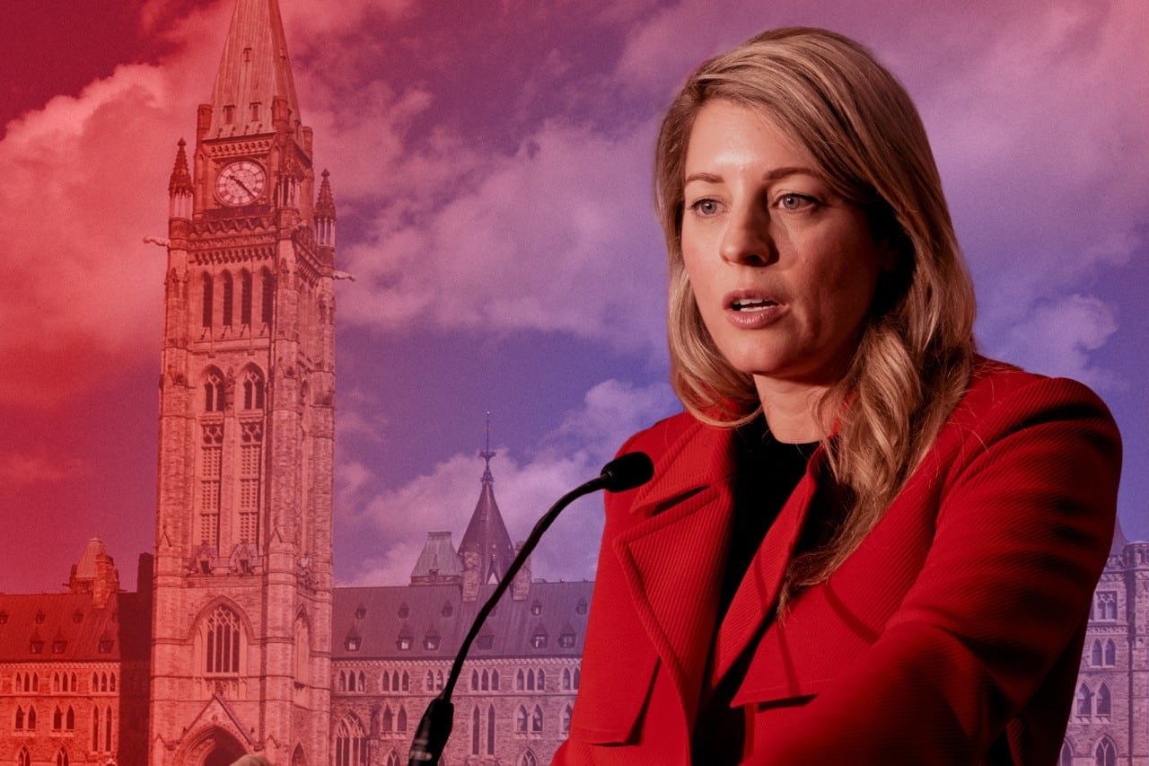 Minister Mélanie Joly stands against a background of parliament.