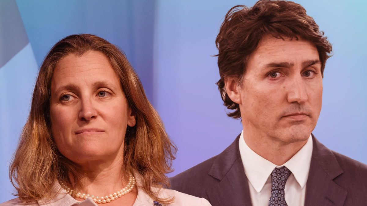 Chrystia Freeland and Justin Trudeau look displeased at each other.