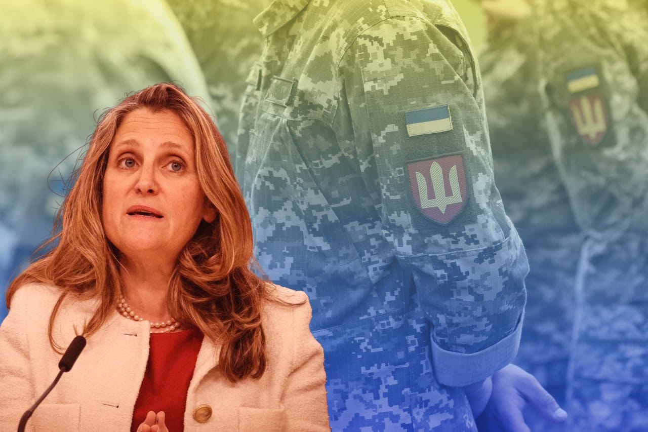 A picture of Chrystia Freeland, with a Ukrainian armed forces soldier in the background.